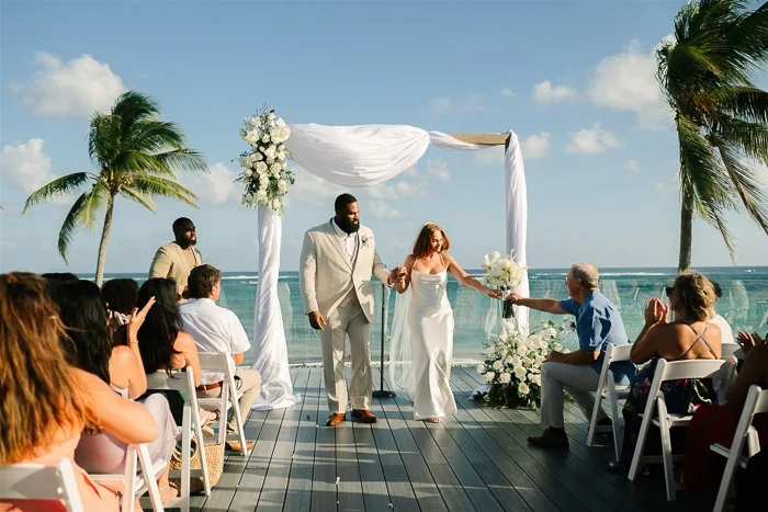 Iowa Couple Emily and Ryan Exchange Vows in Intimate, Experience-Focused Tulum Resort Wedding, Prioritizing Guest Enjoyment and Connection.